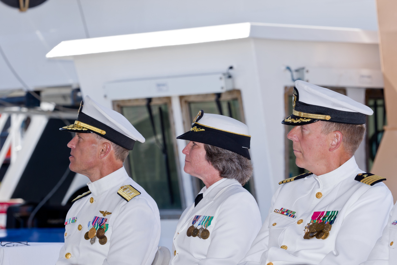 Rear Admiral (UH) Jonathan Bailey, NOAA Corps, Captain Michelle Bullock, NOAACorps, and Navy chaplain at the commissioning ceremony of the NOAAShip BELL M
