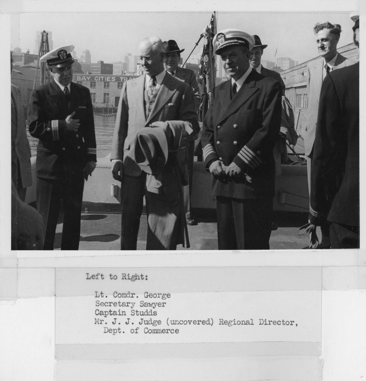 L-R -  Lieutenant Commander Clarence George, Secretary of Commerce Sawyer,Captain Robert Studds, and J