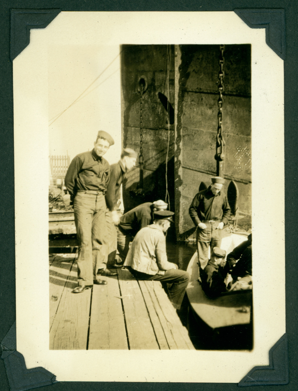 Unidentified officer candidates performing deck maintenance duties