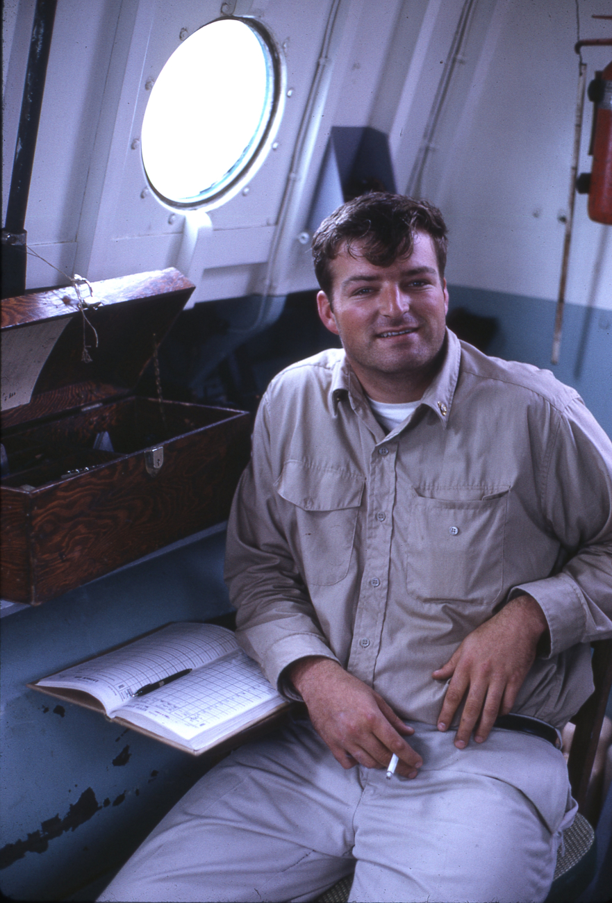 Surveying technician on the USC&GS; Ship PATTON with sounding book