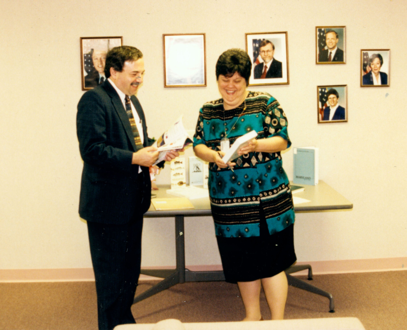 Carol Watts, Director of the NOAA Central Library, with unidentified patron