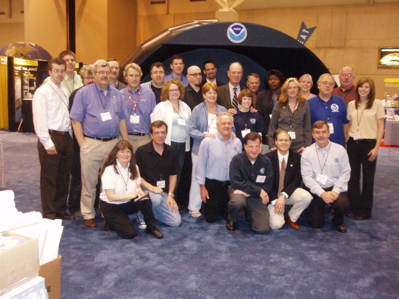 NOAA personnel including representatives of the NOAA Office of Education,National Weather Service, National Ocean Service, Office of Oceanic andAtmospheric Research, and National Environmental Satellite, Data InformationService surrounded ocean explorer Dr