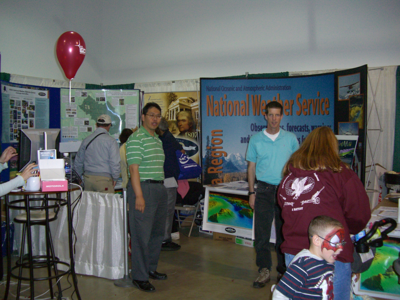 Members of NOAA's National Weather Service Alaska Region, National MarineFisheries Service Alaska Region, Office of Atmospheric Research BarrowObservatory man a booth at the Alaska State Fair at Palmer