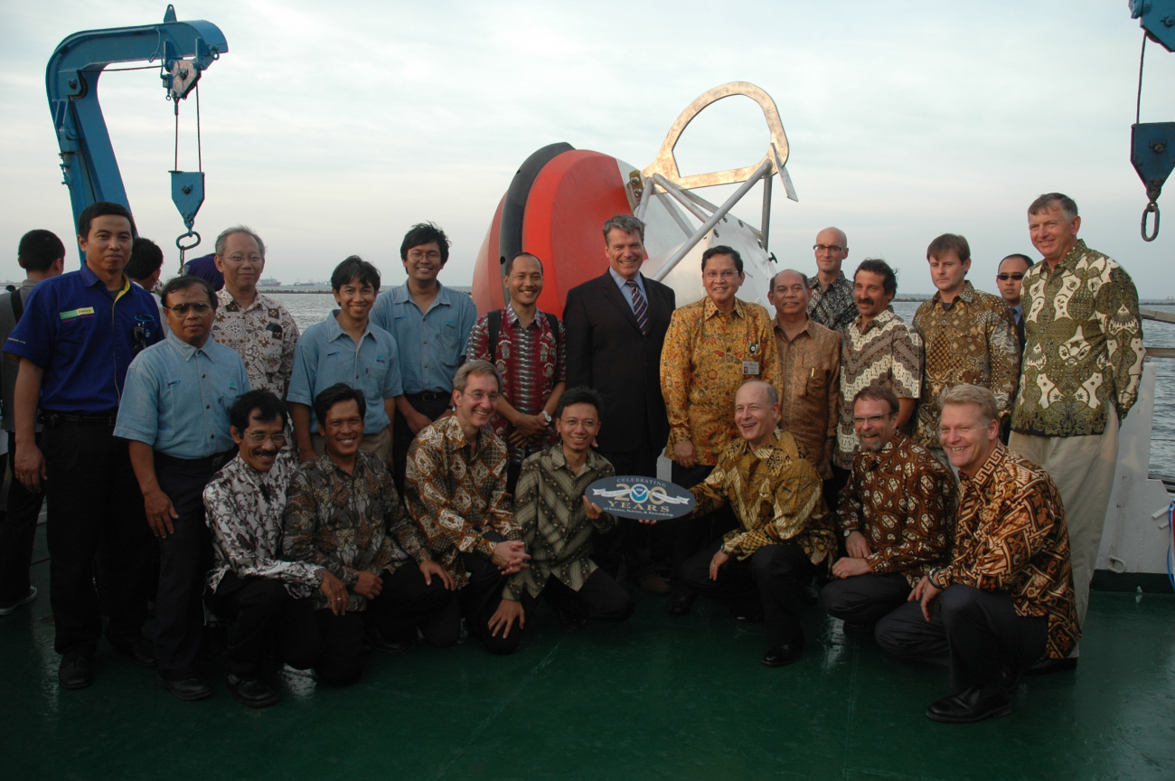 Participants celebrating the launch of a tsunami buoy in the Indian Ocean tooktime to commemorate NOAA's 200th celebration on the deck of the Indonesian R/VBaruna Jaya III before it left Jakarta in mid-September with the buoy and fourNOAA climate buoys on board
