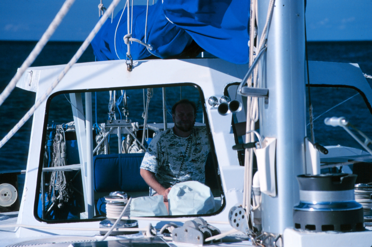 A restoration worker uses a marine radio on board the Cunan Law toprepare for a site visit