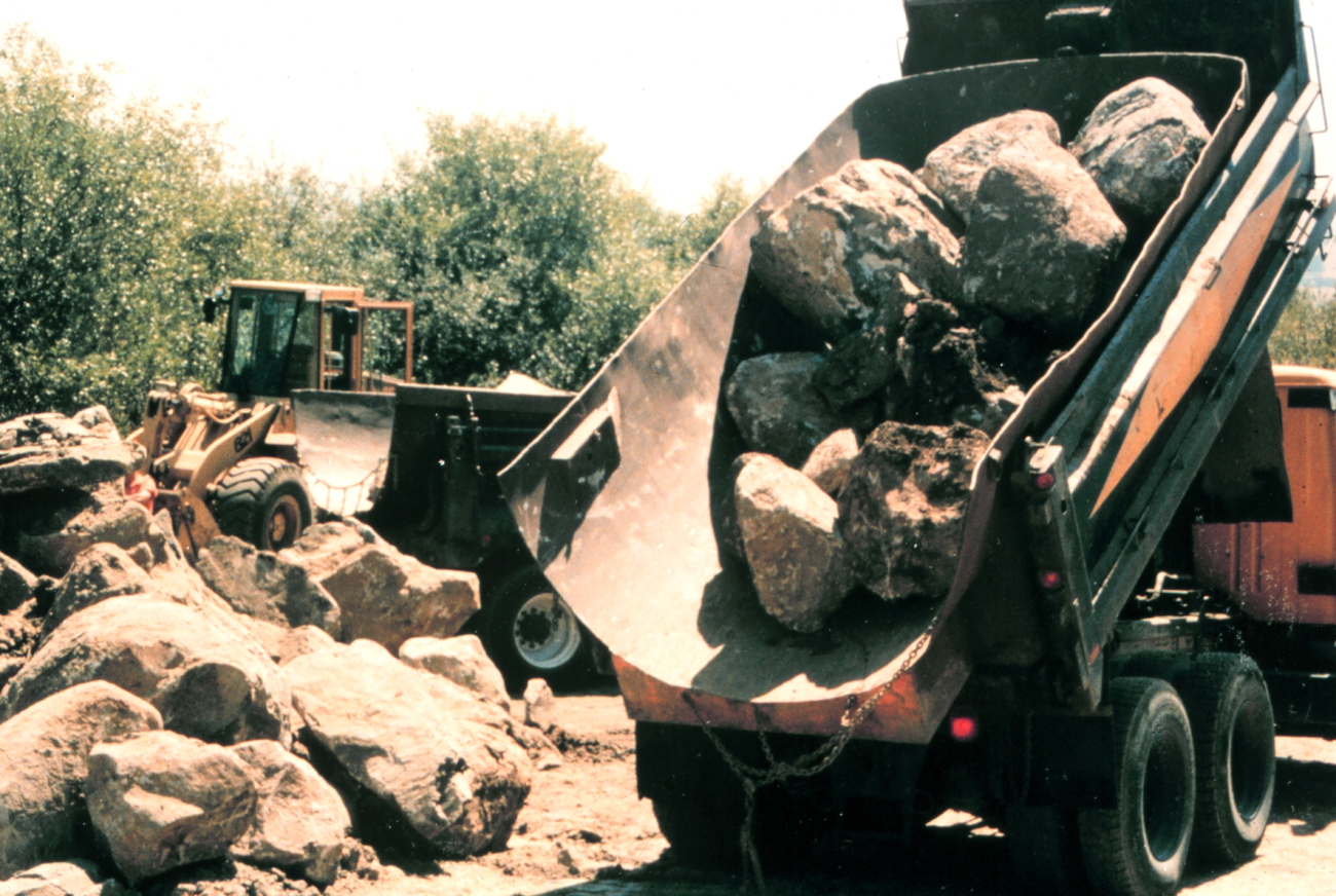 Heavy equipment places the boulders that were used to construct the fishpools