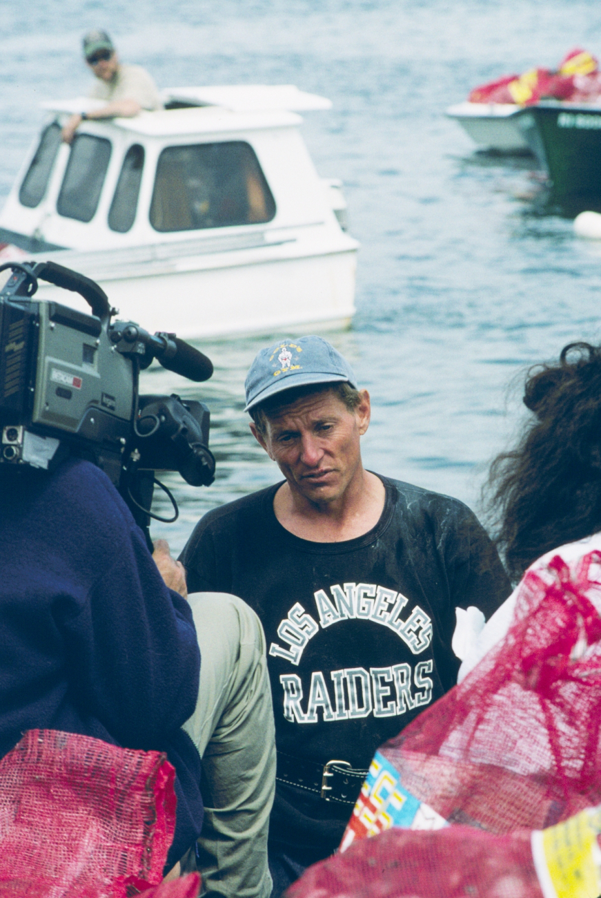 A local shellfisherman gives an interview in support of the restoration work