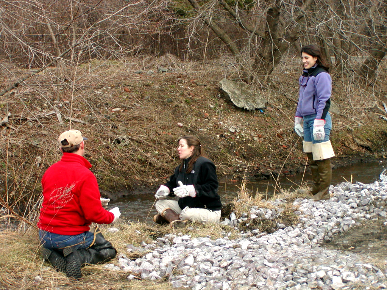 Volunteers work on site with Karen Young (standing) of Salem Sound2000