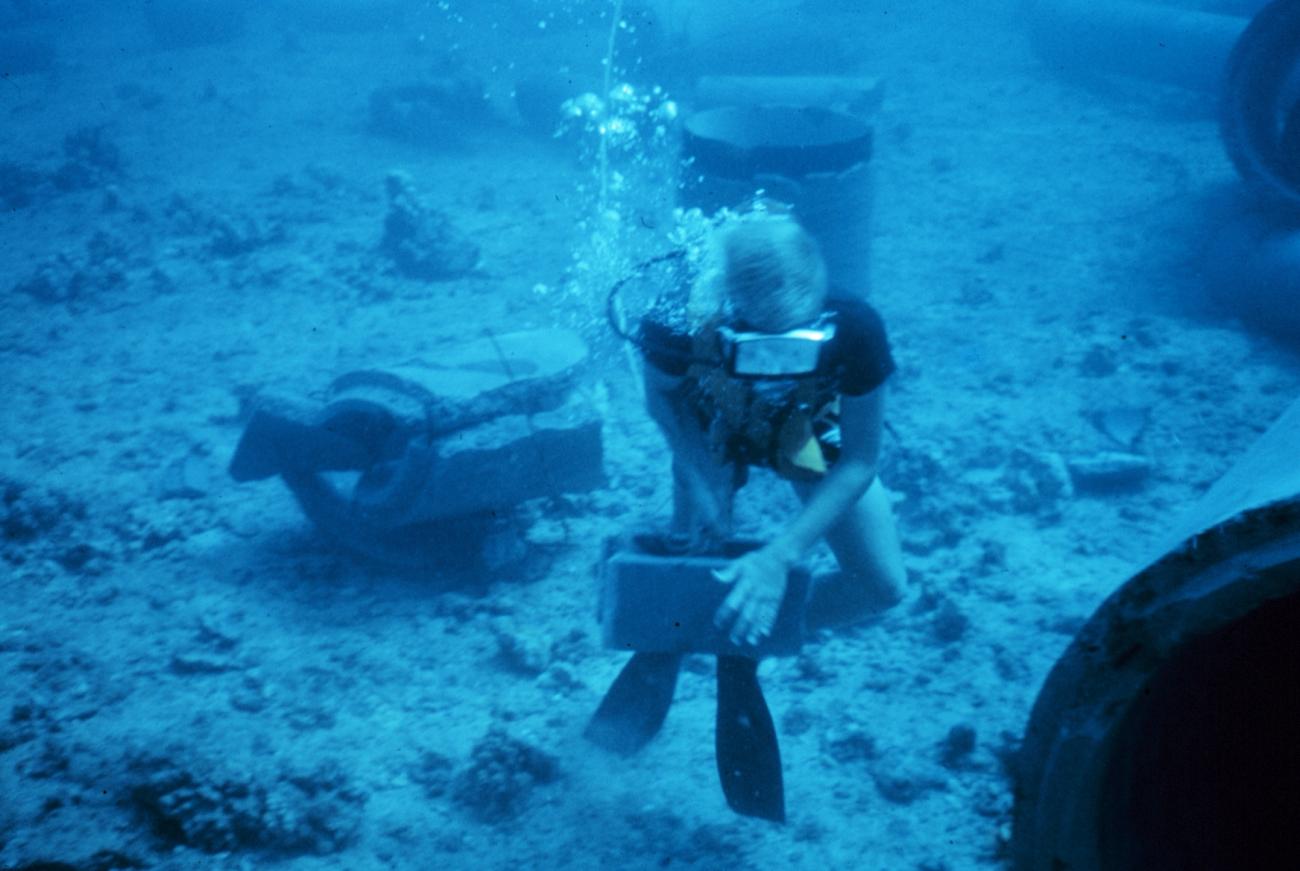 Diver laying transect line for conducting fish survey