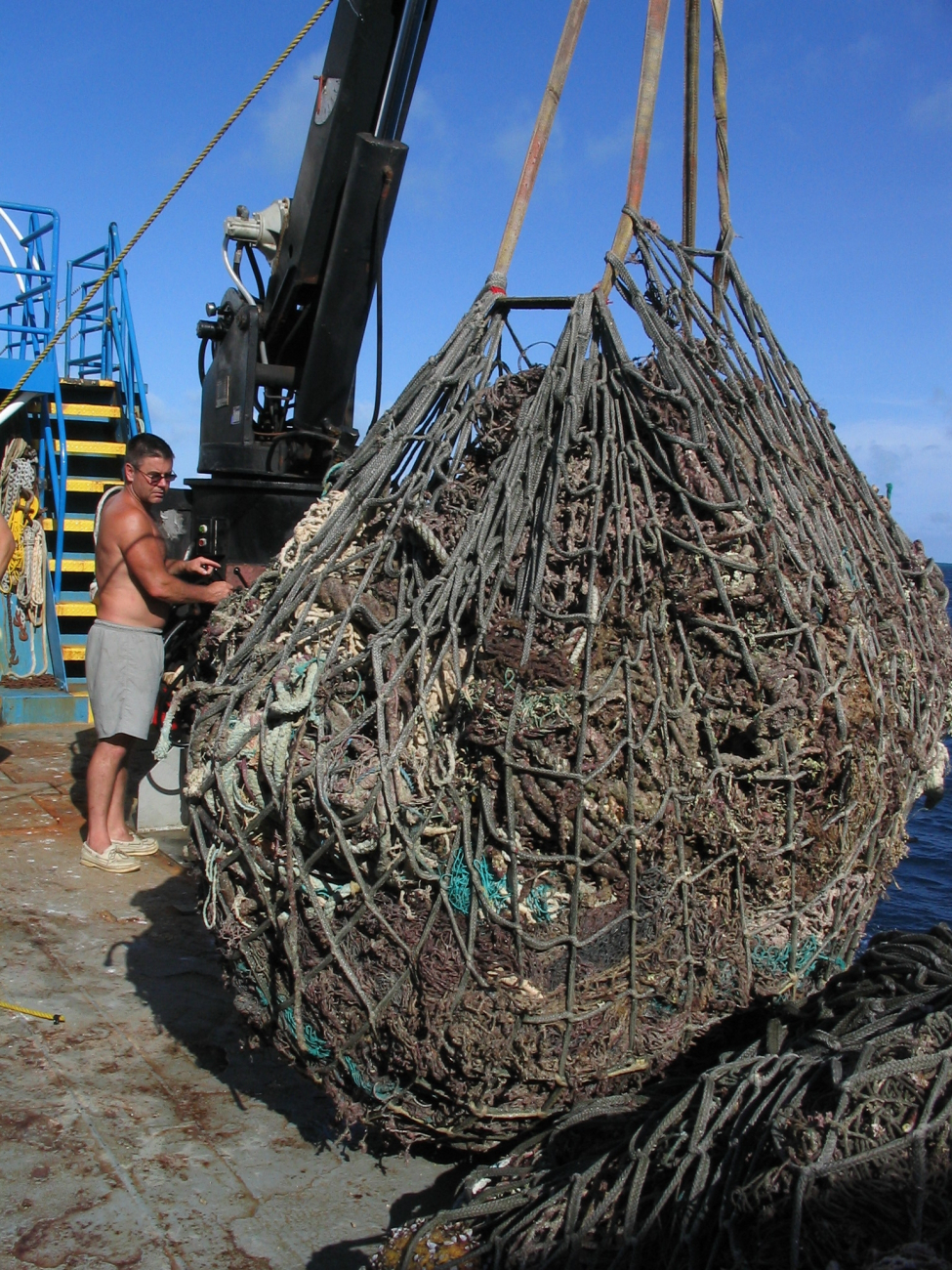 A big load of derelict net debris being loaded onto the deck of contract vesselCASITAS