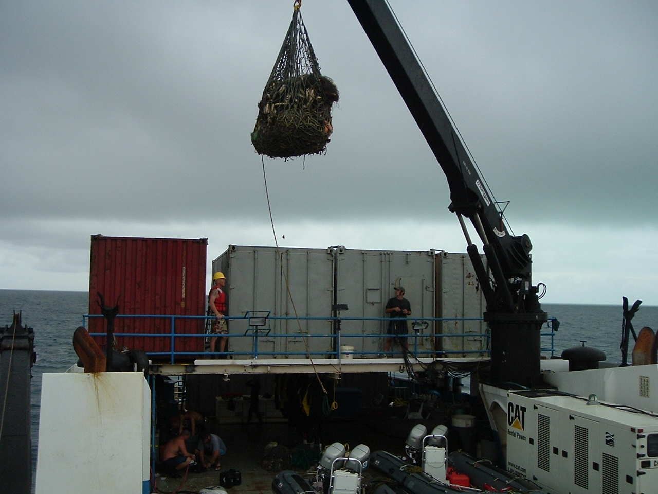 Putting debris in shipping containers for final disposition