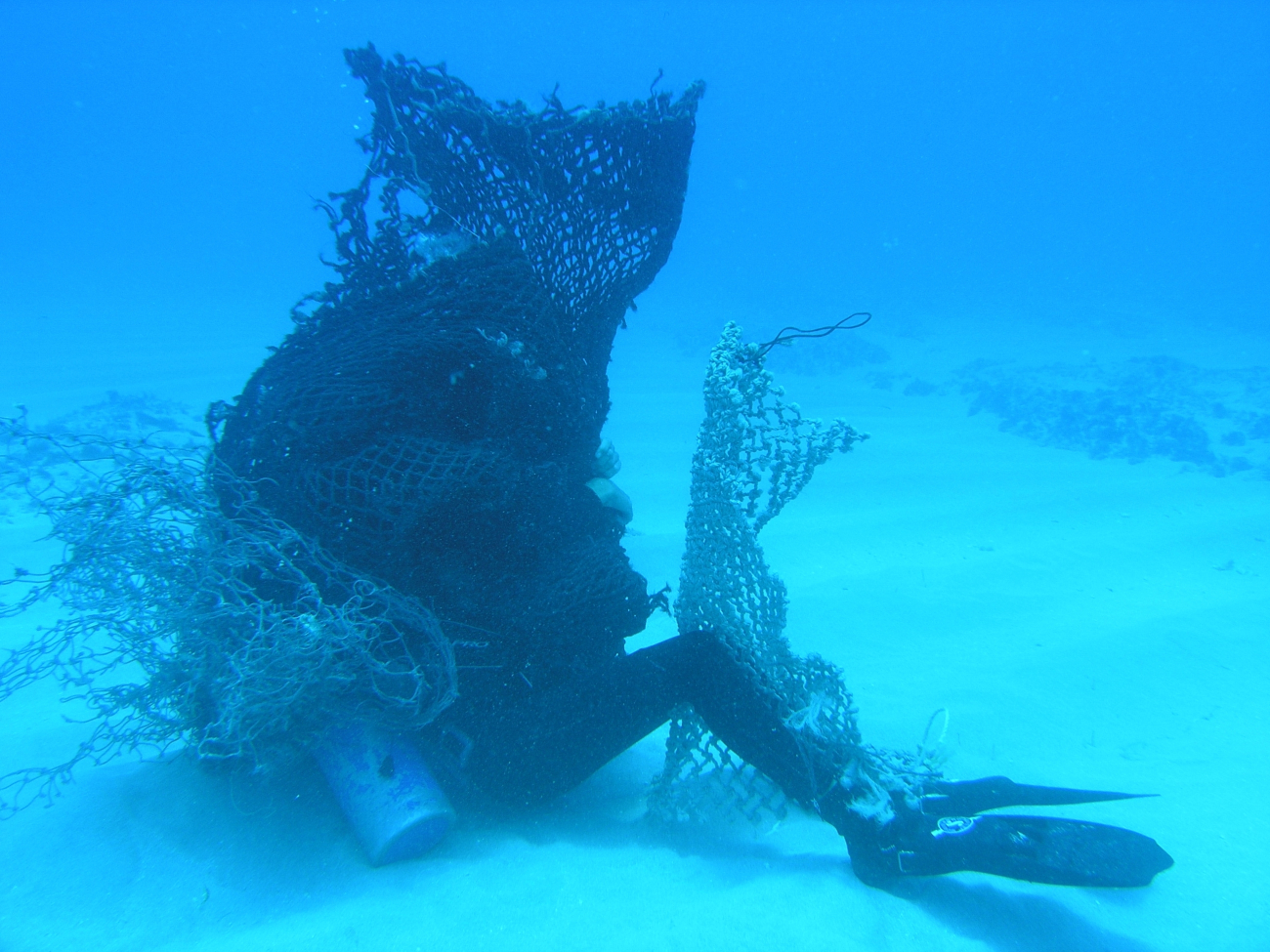 As part of Marine Removal Debris Diver training, Joel Paschal is entangledin the dreaded Net Monster and must free himself while wearing a blacked-out mask
