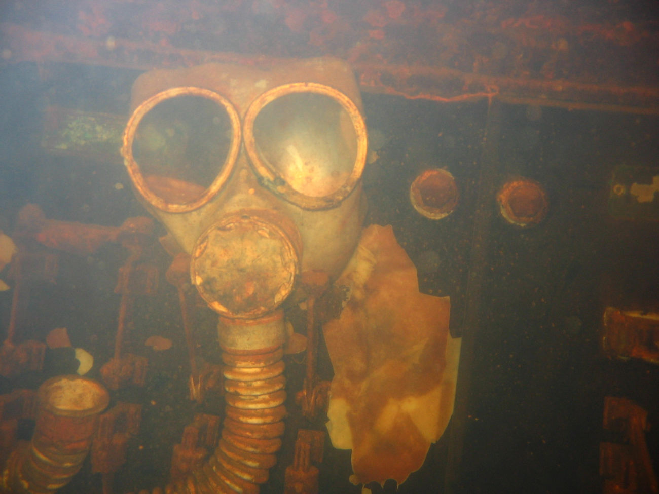 Gas mask staring at divers entering the engine room of the Fujikawa Maru