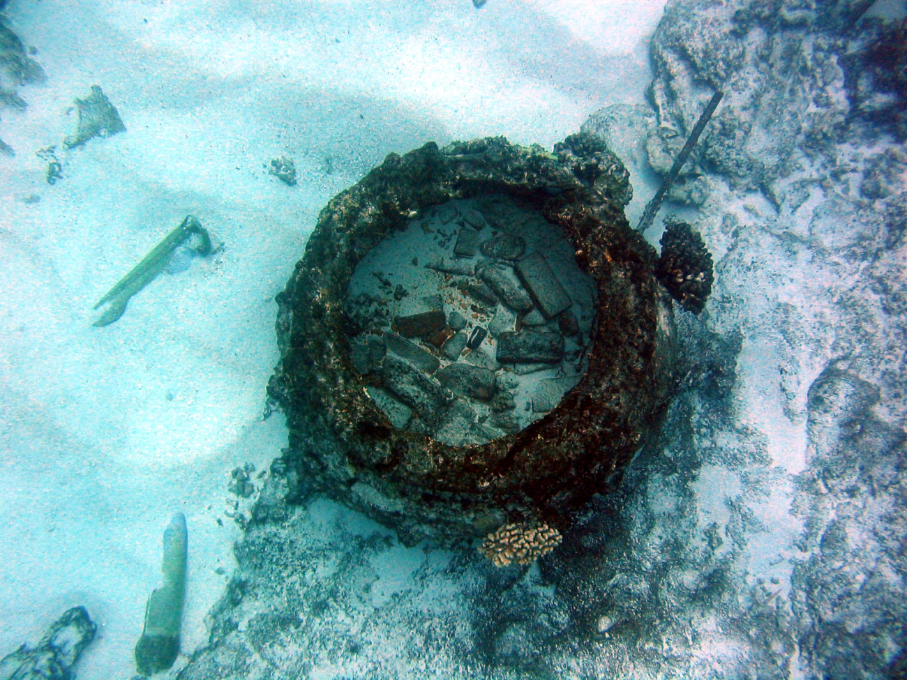 Looking down into a blubber rendering pots from the wreck of an early Nineteenth Century whaling vessel on Pearl and Hermes Reef