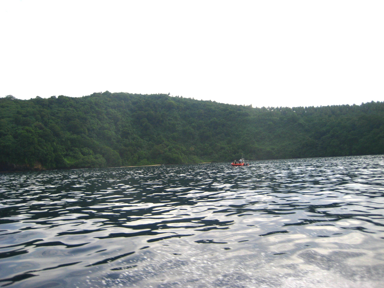 Scientists conducting studies from a RHIB in the vicinity of Fagatele Bay