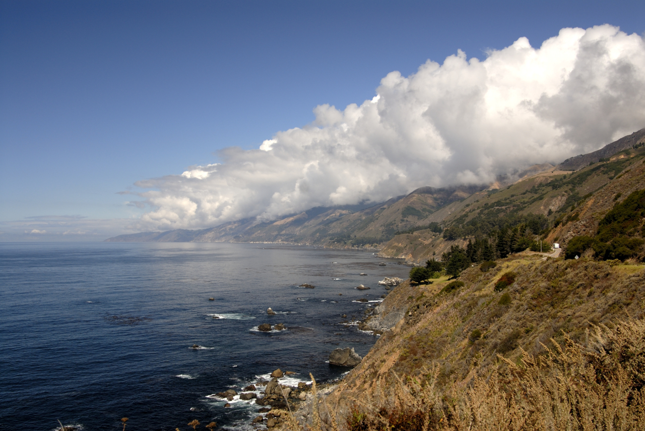 Looking north along the Big Sur coastline as orographic clouds form over SantaLucia Mountains