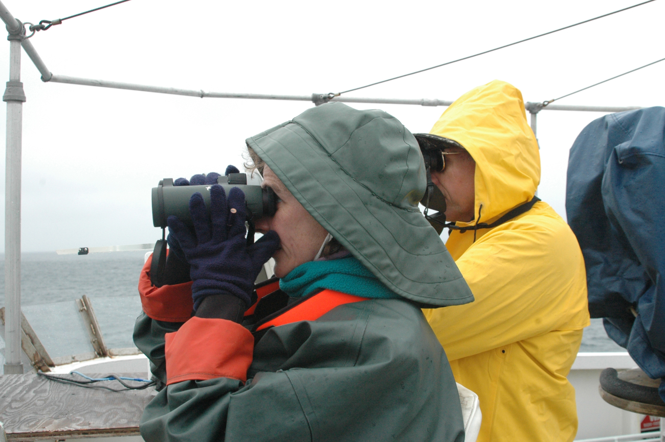 Seabird observers Barbara Blackie and Scott Mills are searching for birds fromthe NOAA Ship McARTHUR II while it was operating in sanctuary waters