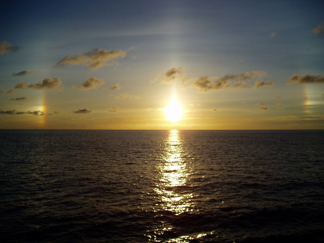 A tropical sunset over a placid sea