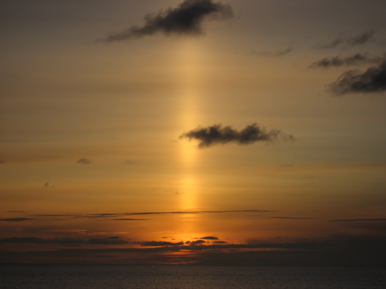 A sun pillar following the setting of the sun