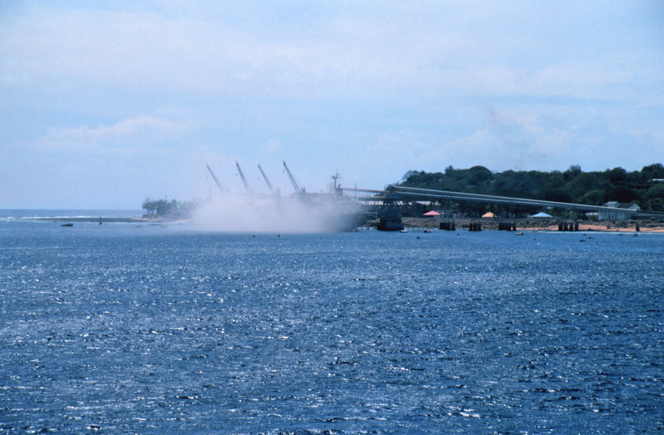 A view of filling a bulk carrier ship with phosphate at the piers at Nauru asseen from the NOAA Ship RONALD H