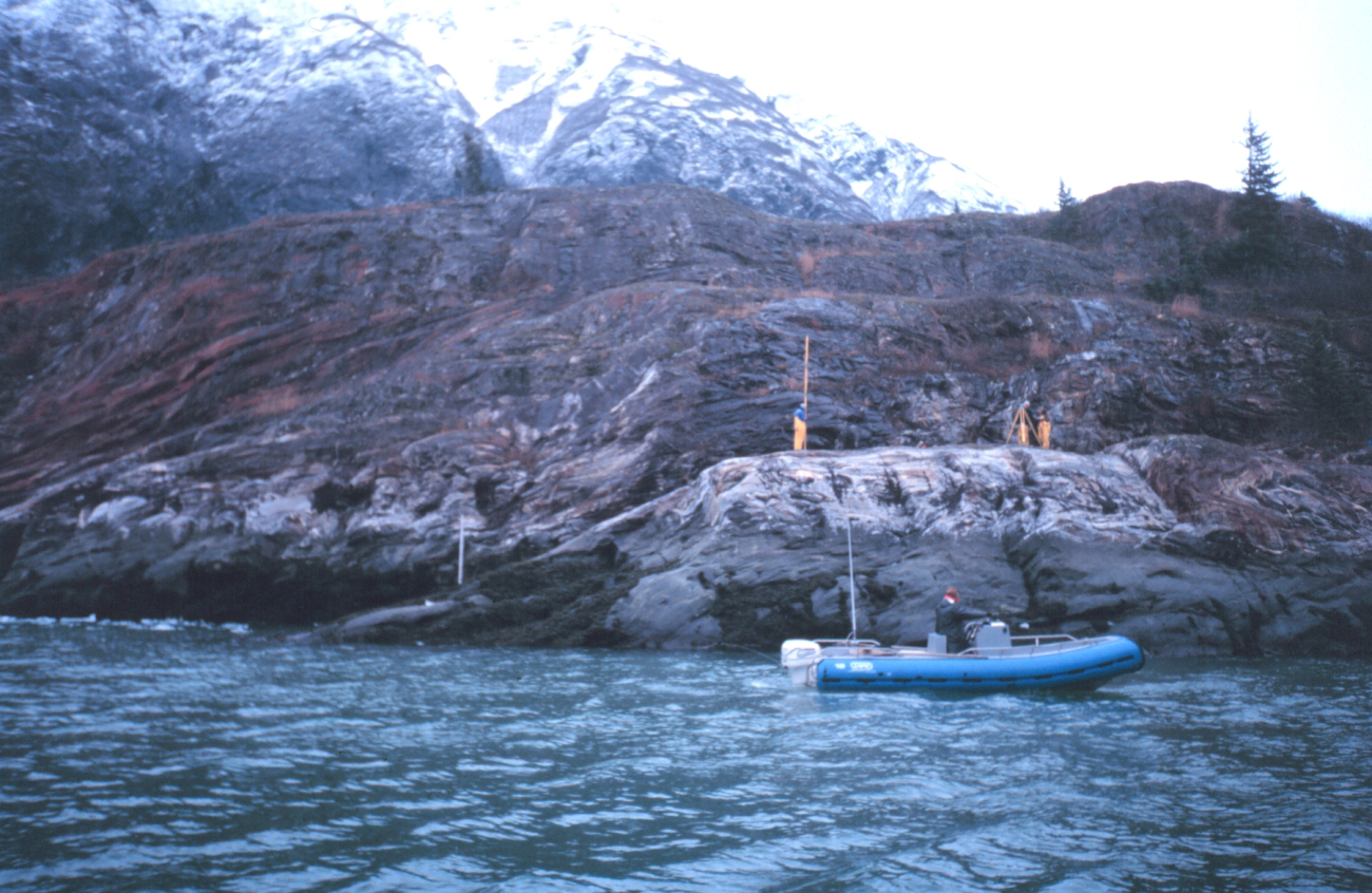 The Tide Gauge Team installing a tide gauge in the icy waters of Tracy Arm