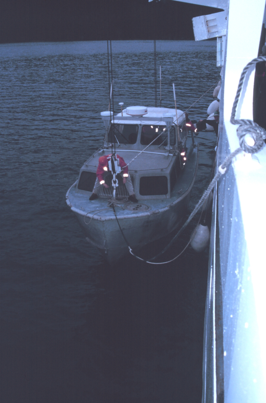 Senior Survey Tech Paul McAnally secures the bow hook on RA-1 prior to hoistingboat out of water