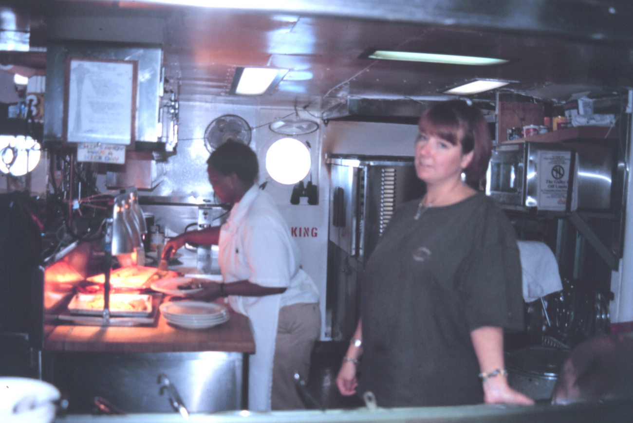 Chief Cook Doretha and 2nd Cook Sarah Satterfield prepare another fine meal inthe ship's galley