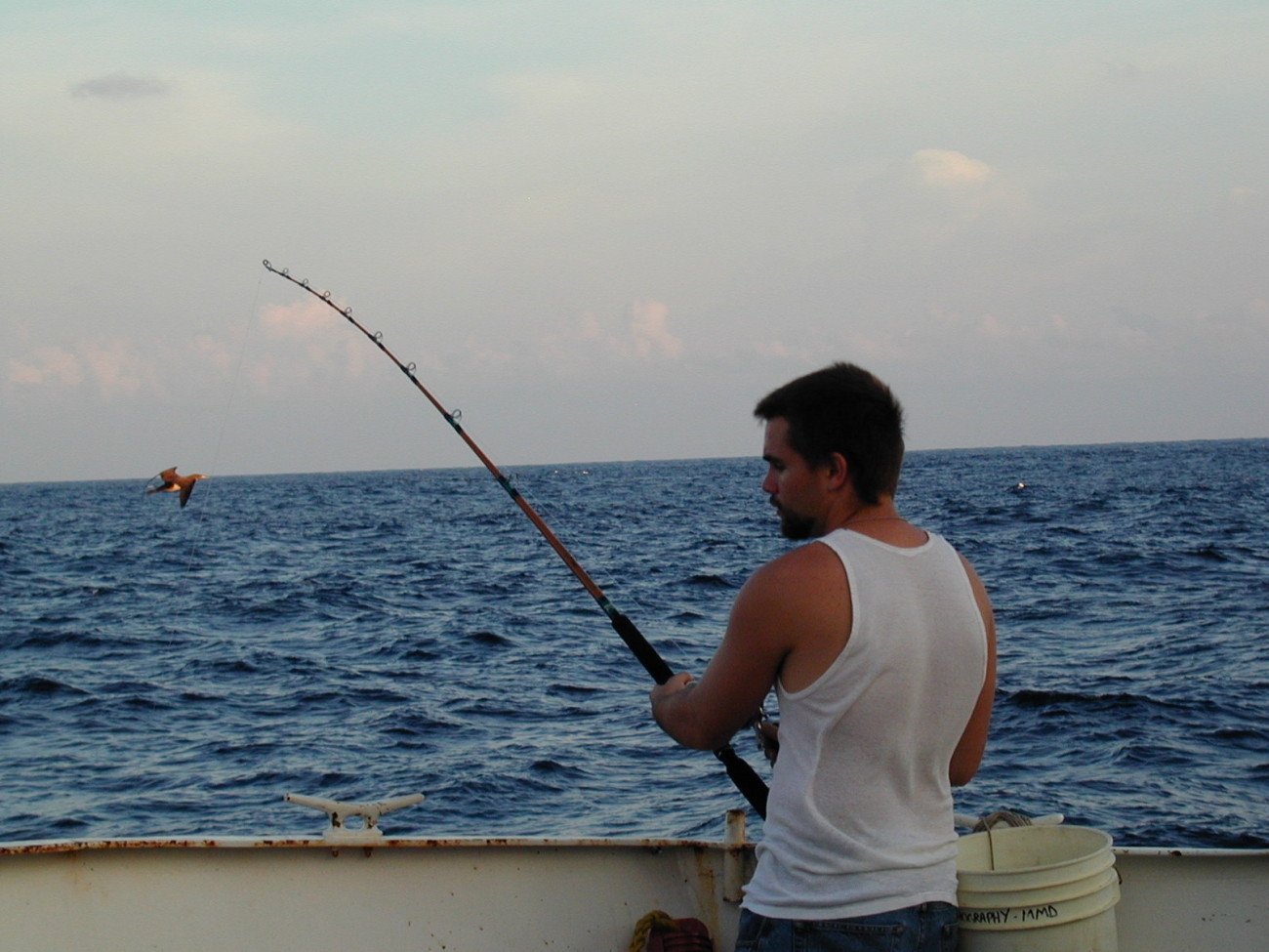 McARTHUR deck hand Michael Theberge fishing during free time in theEastern Tropical Pacific