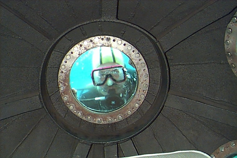 Diver peering through viewing port of DAVID STARR JORDAN