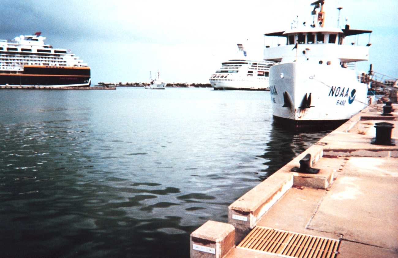 The McARTHUR dwarfed by cruise ships as it enters Key West Harbor