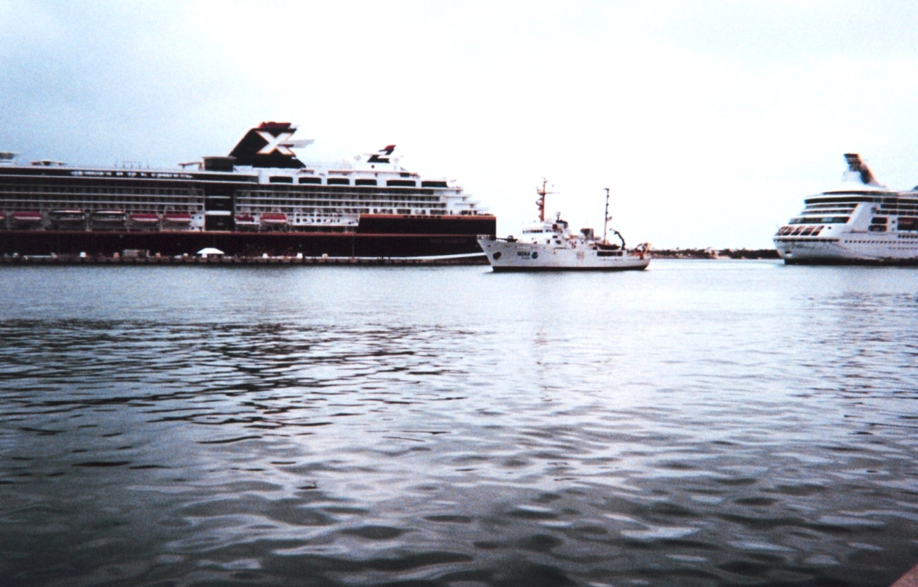 The McARTHUR dwarfed by cruise ships as it enters Key West Harbor