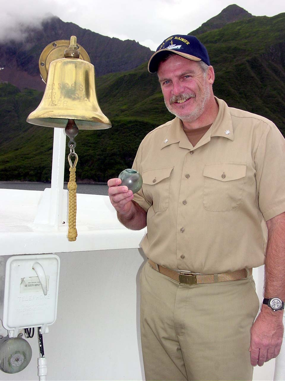 Captain John Humphrey with a newly found prized glass net float - Fish Hook Bay