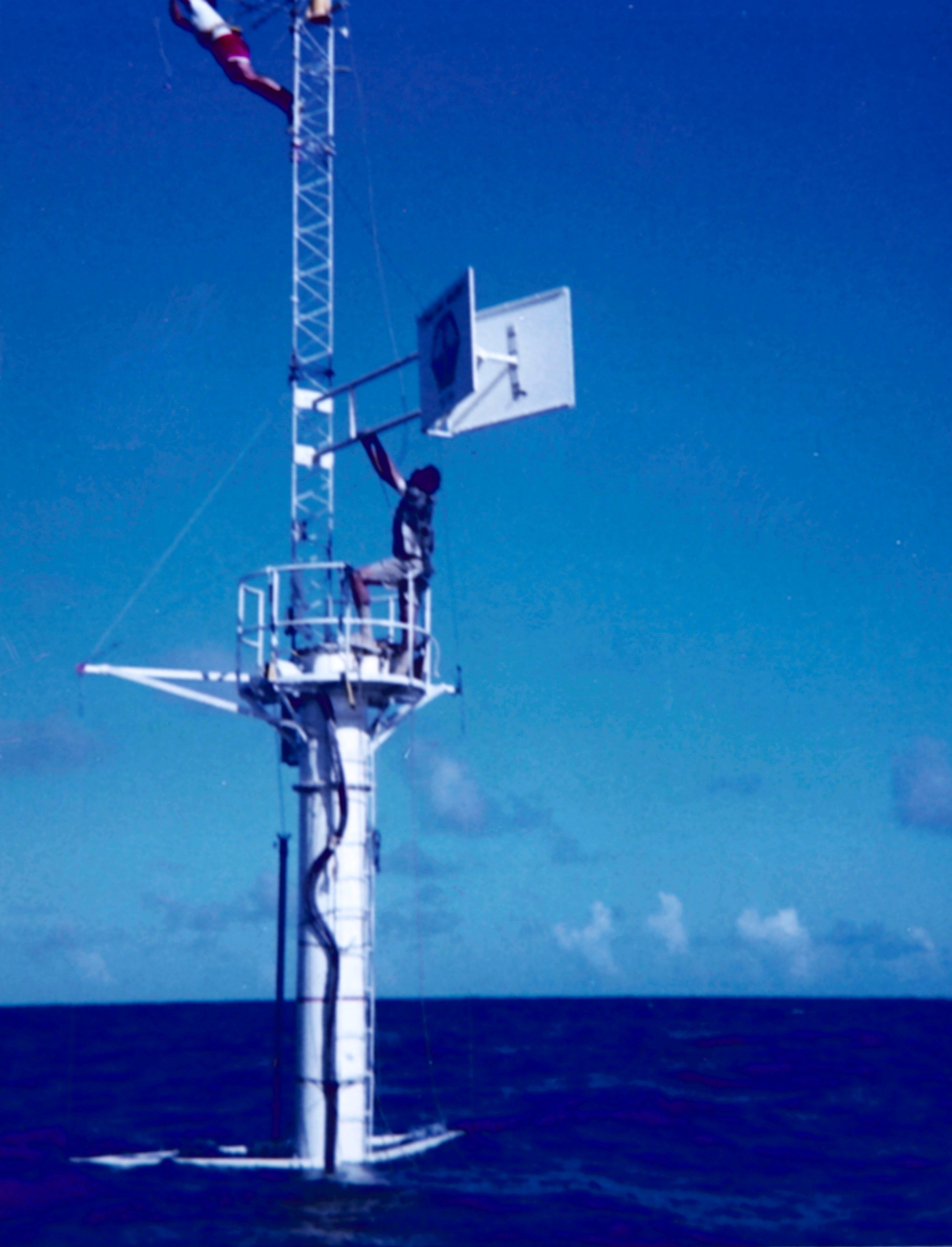 Solar radiance tower and instruments mounted to a bottom-anchored spar buoy