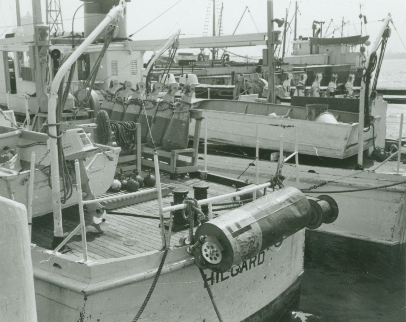 Stern of wiredrag vessel HILGARD with WAINWRIGHT tied up outboard