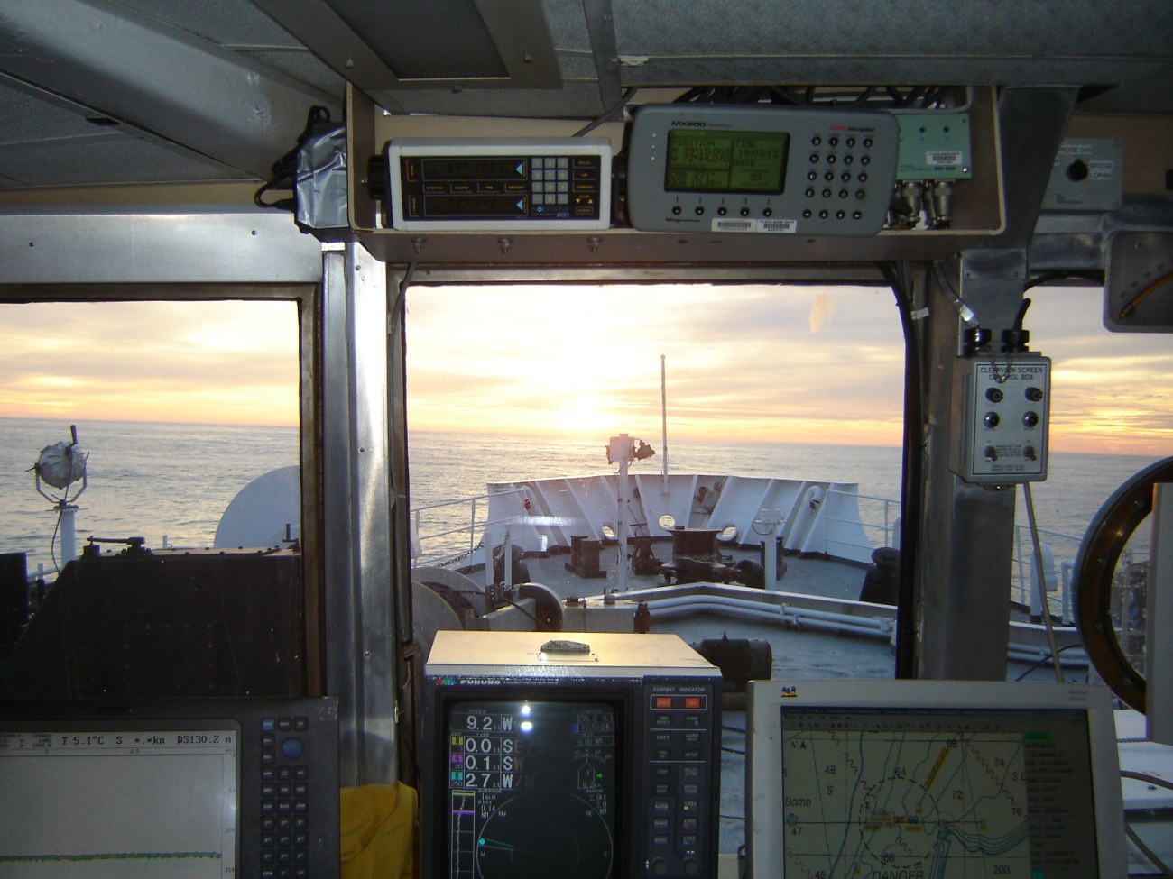 View from the pilot house of the NOAA Ship DELAWARE II at sunset