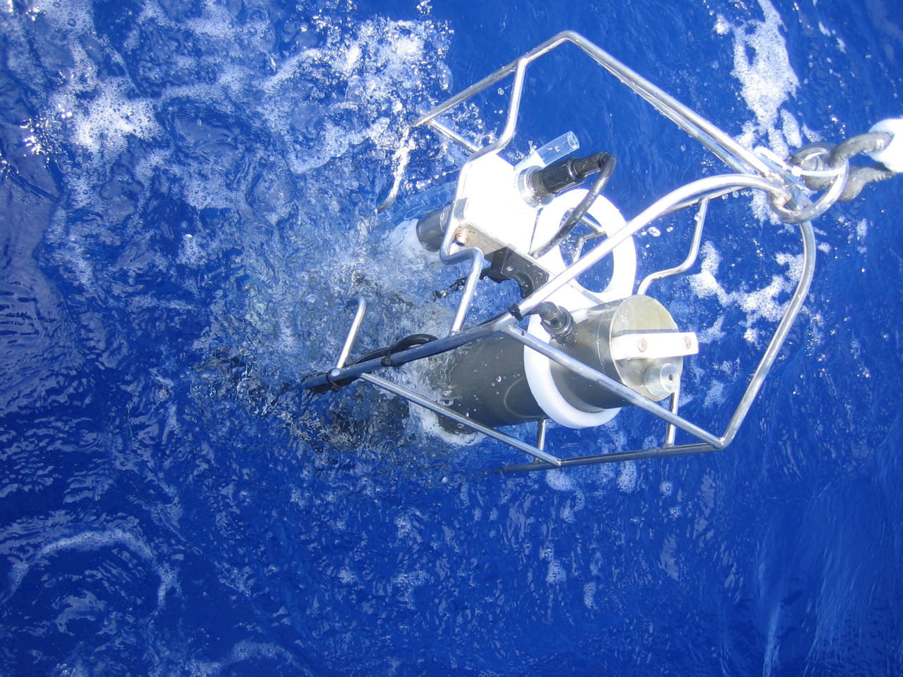 CTD equipment is being pulled up manually off the Mexican ship BIPduring a coastal oceanographic cruise off the waters of Xcalak between NOAAand ECOSUR
