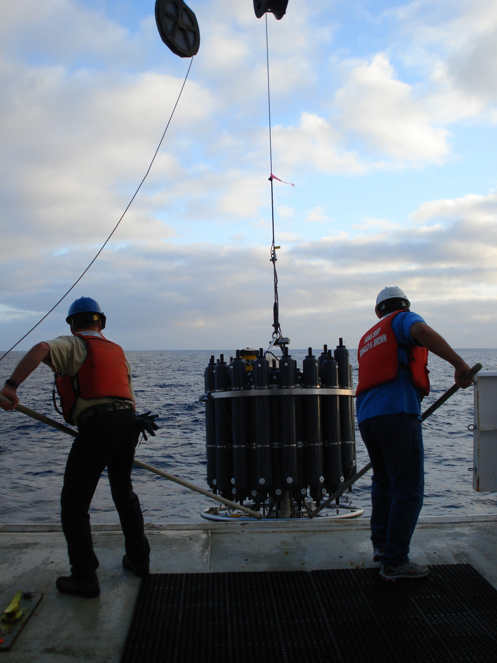 Johnny and Pedro recovering a CTD instrument and water sampling array
