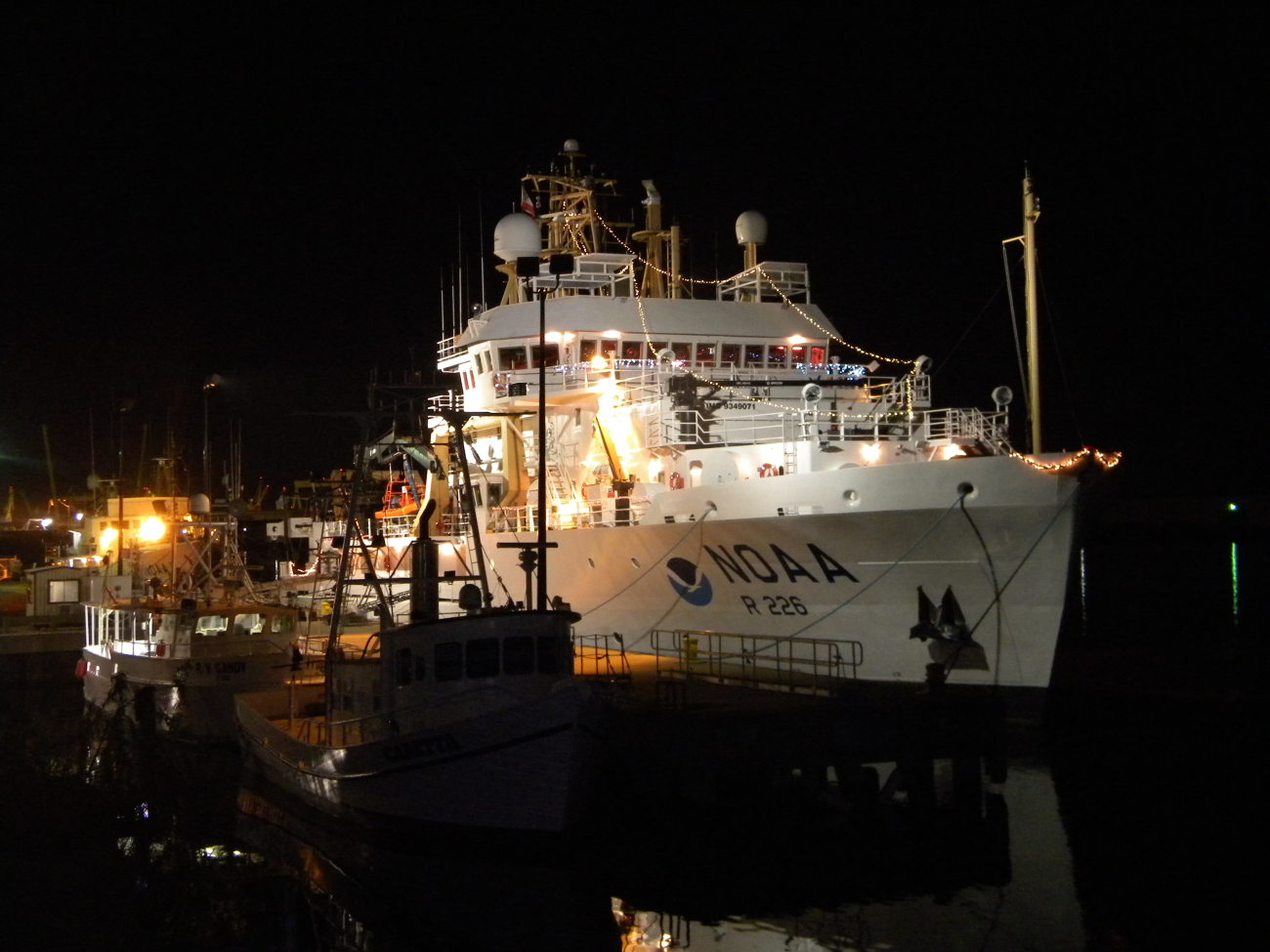 NOAA Ship PISCES at the pier at Pascagoula dressed in holiday lighting