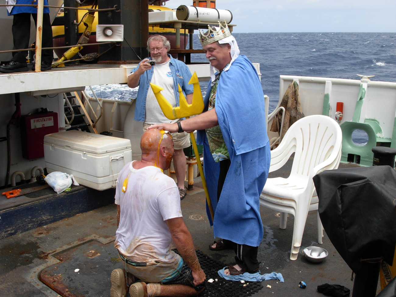 King Neptune meting out royal justice on a pollywog during equator crossingceremonies on the NOAA Ship KA'IMIMOANA (R333)