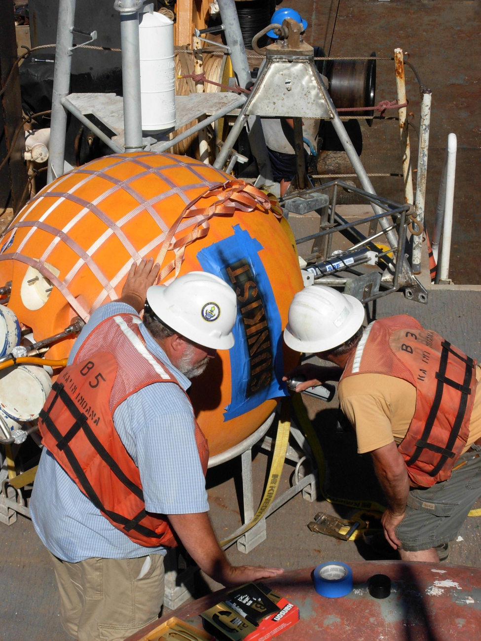 Preparing an instrument package on the NOAA Ship KA'IMIMOANA
