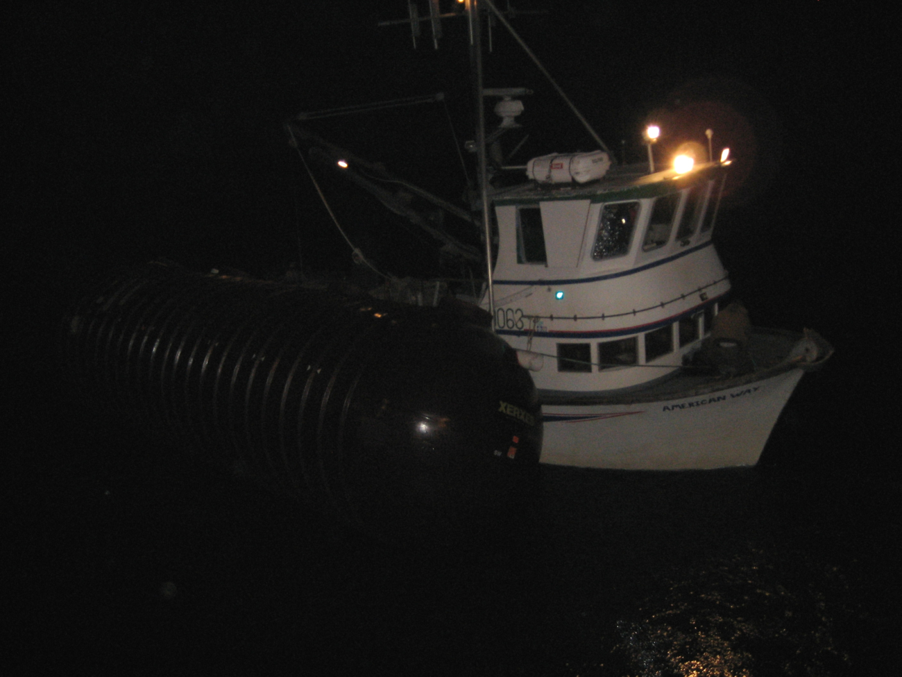 Fishing vessel tied up outboard of SS Coastal Nomad during ferocious winterstorm