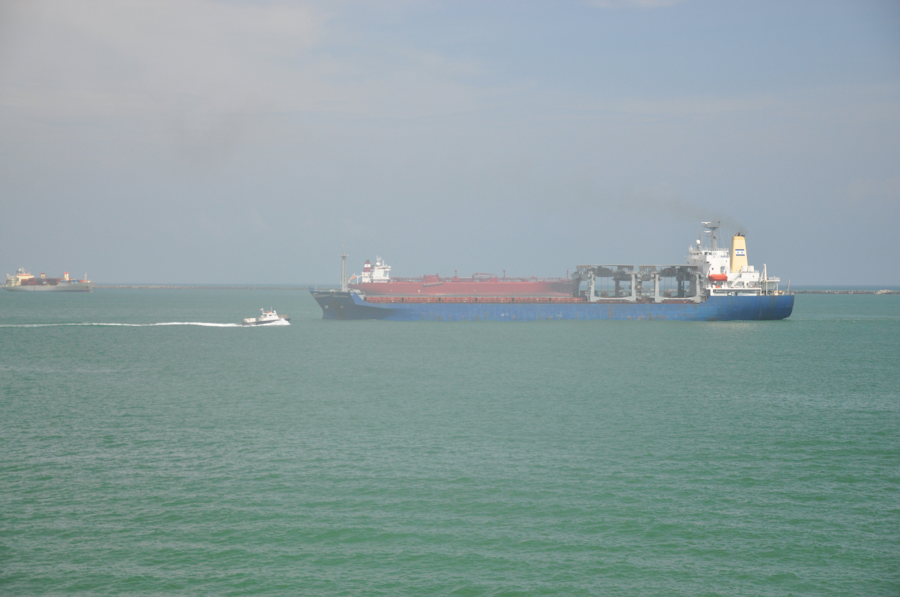 Pilot boat approaching vessel waiting to transit the Panama Canal