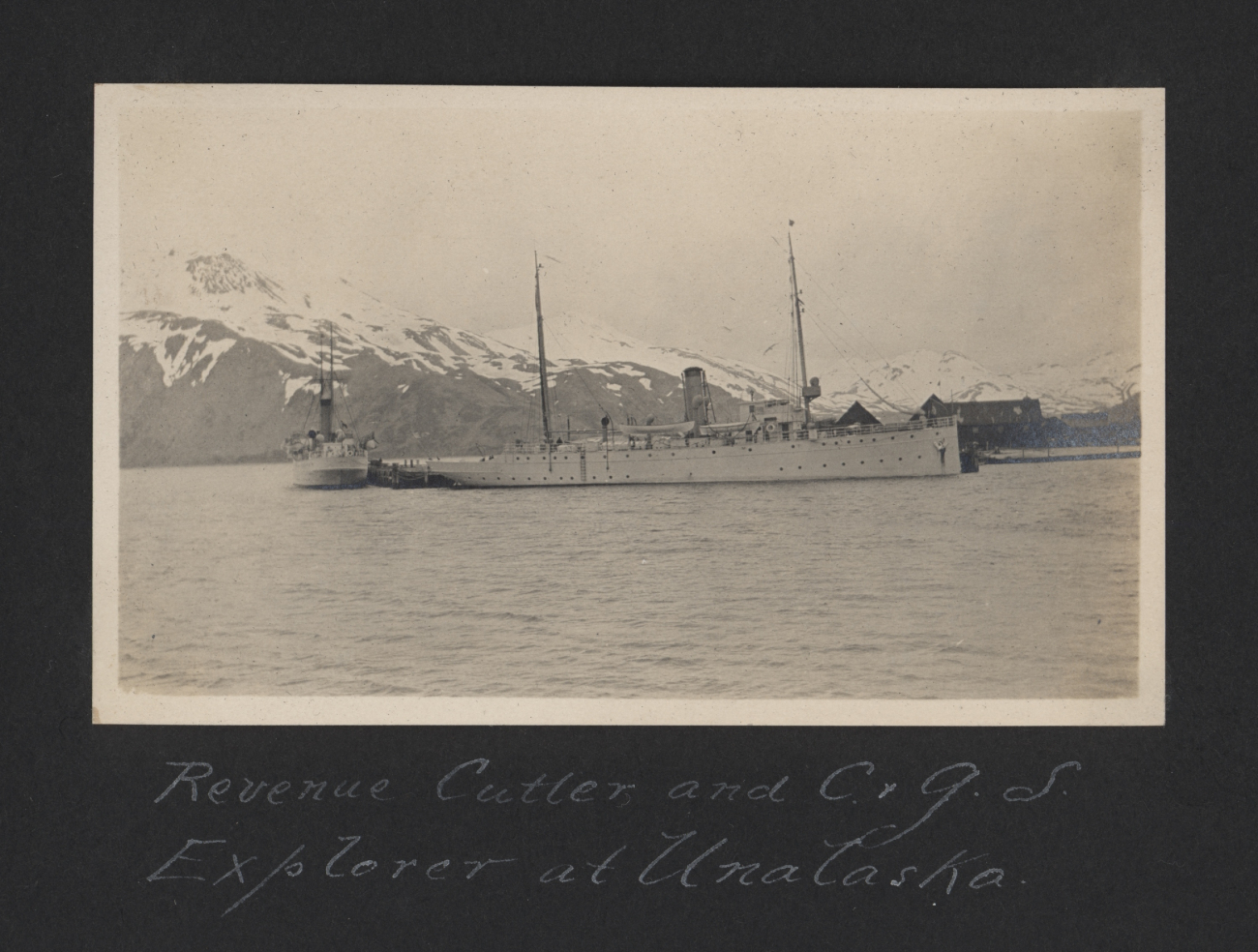 Revenue Cutter (broadside) and C&GS; Ship EXPLORER at Unalaska (Dutch Harbor)