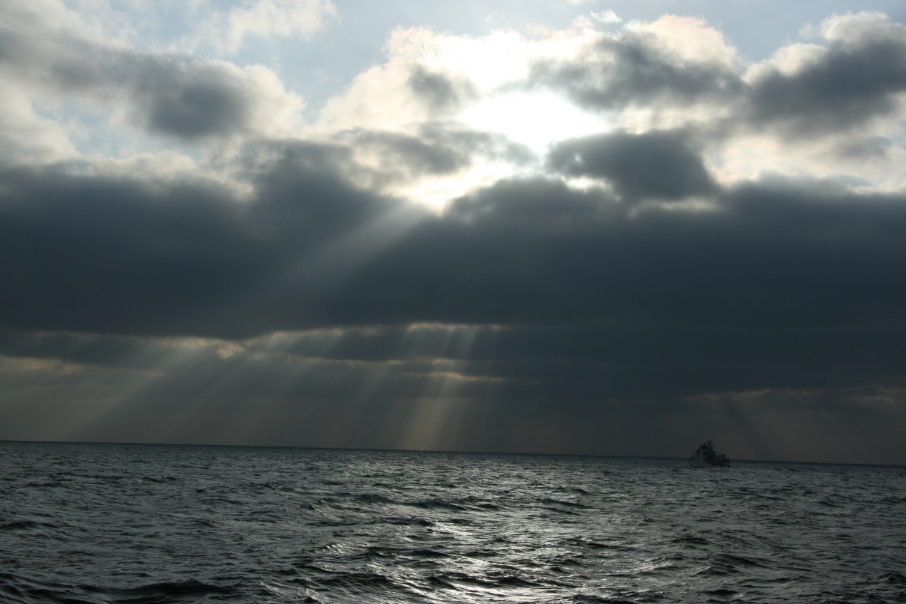 NOAA Ship OSCAR DYSON seen in the crepuscular rays of a late afternoon sun