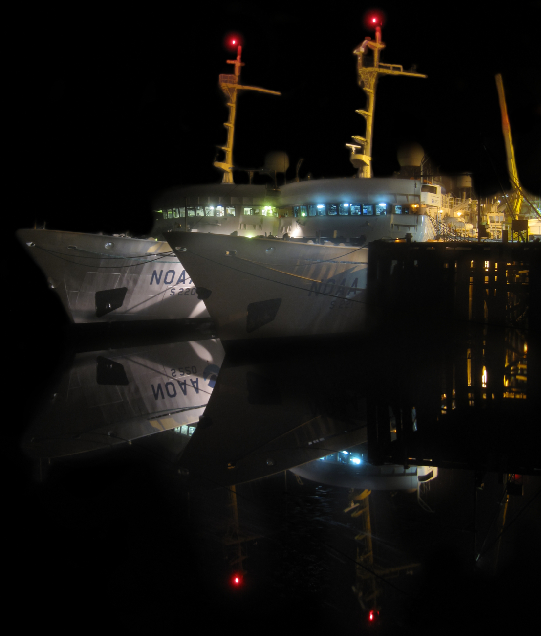 Night view of NOAA Ship FAIRWEATHER tied up outboard of NOAA Ship RAINIERat Petersburg pier