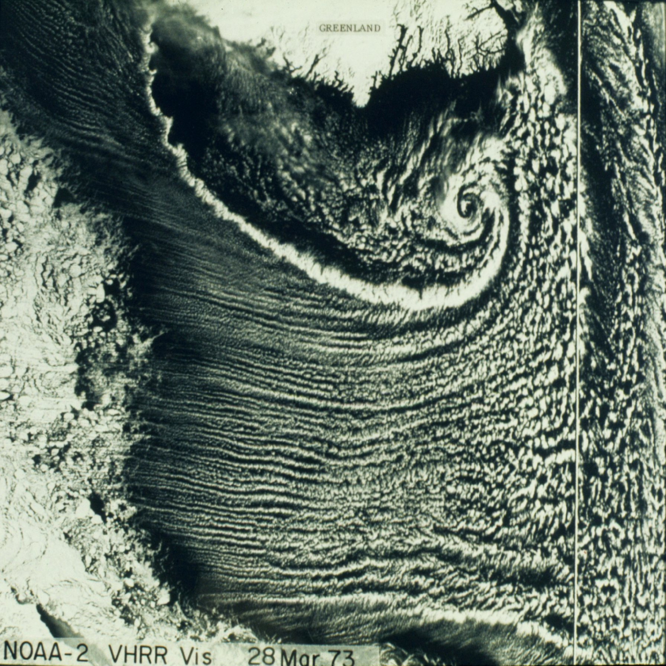 A remarkable vortex south of Greenland with trailing front and cloud streets tothe south