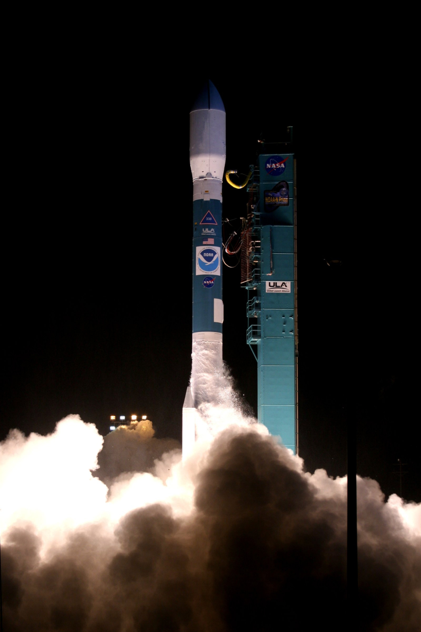 NOAA-N satellite leaps away from the smoke and steam clouds as it lifts off at6:22 A