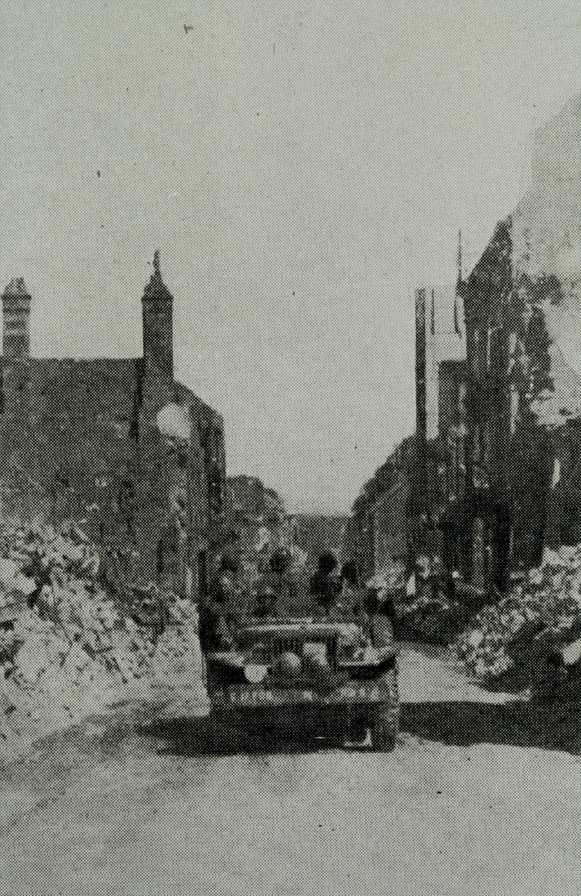 Survey party entering Vire, France, shortly after D-Day