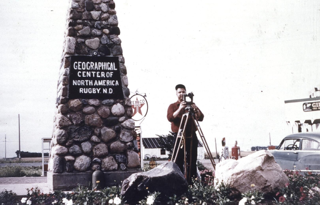 Bob Pryce operating theodolite at Geographical Center of North America