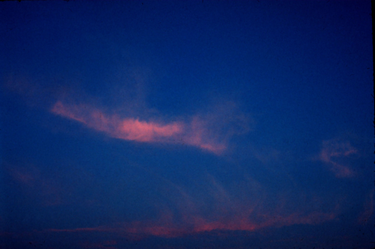 Cirrus spreading over sky at sunset